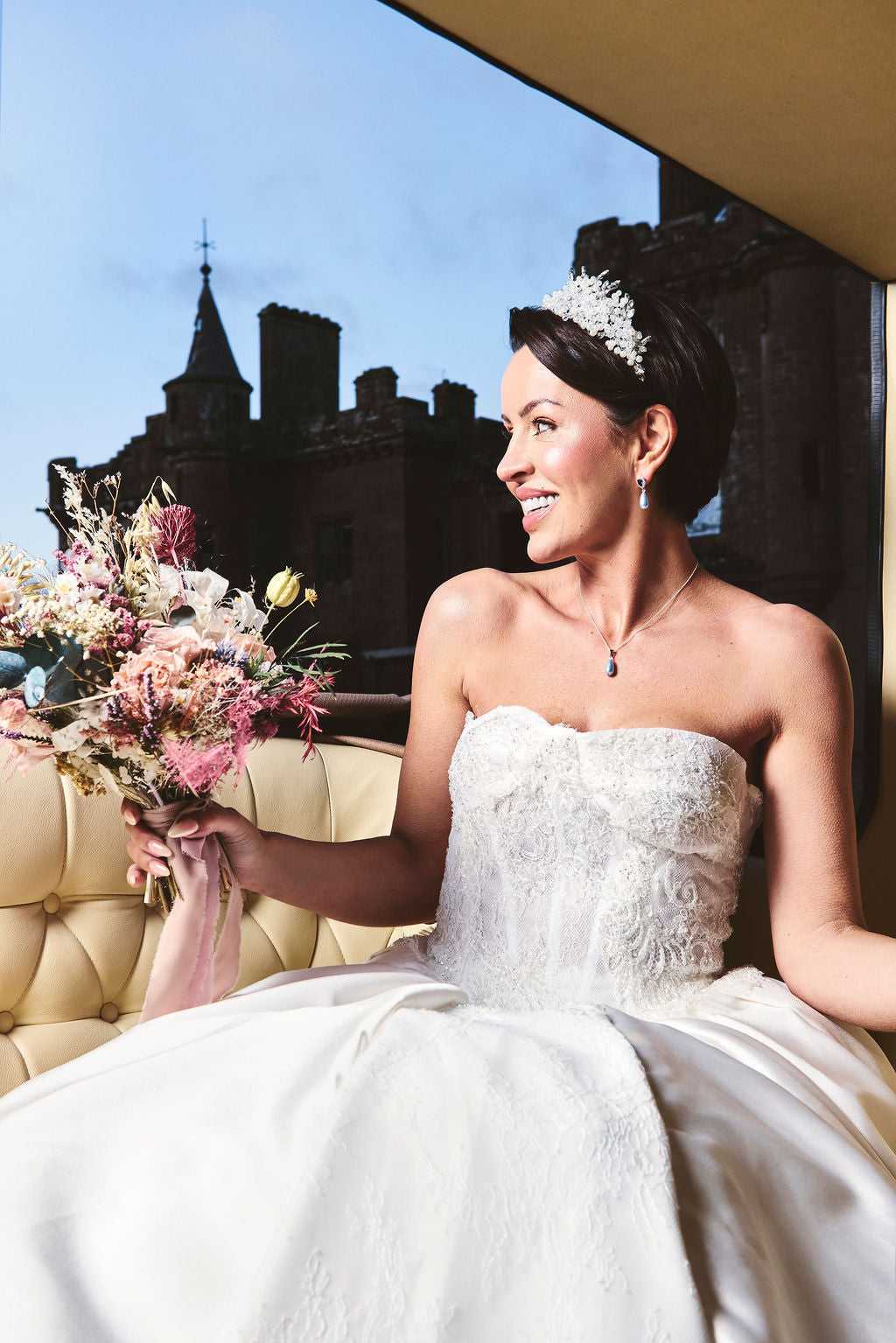 bride wearing crown and baby blue bridal jewellery