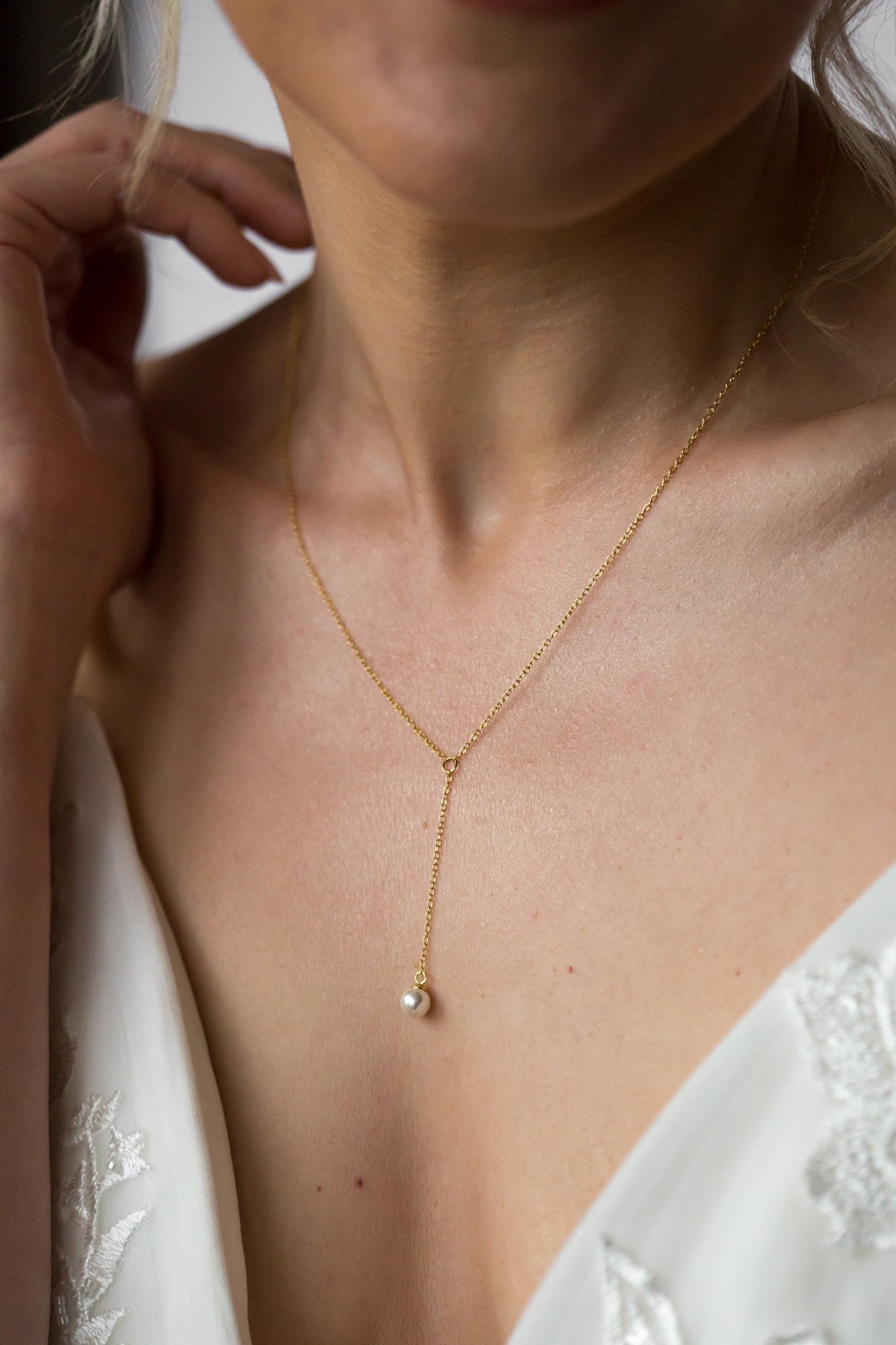 pearl lariat necklace on bride