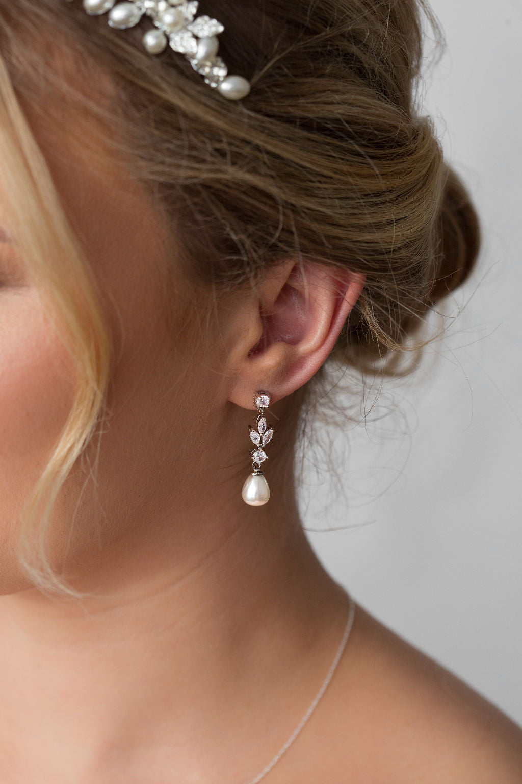 bride with long pearl crystal earrings