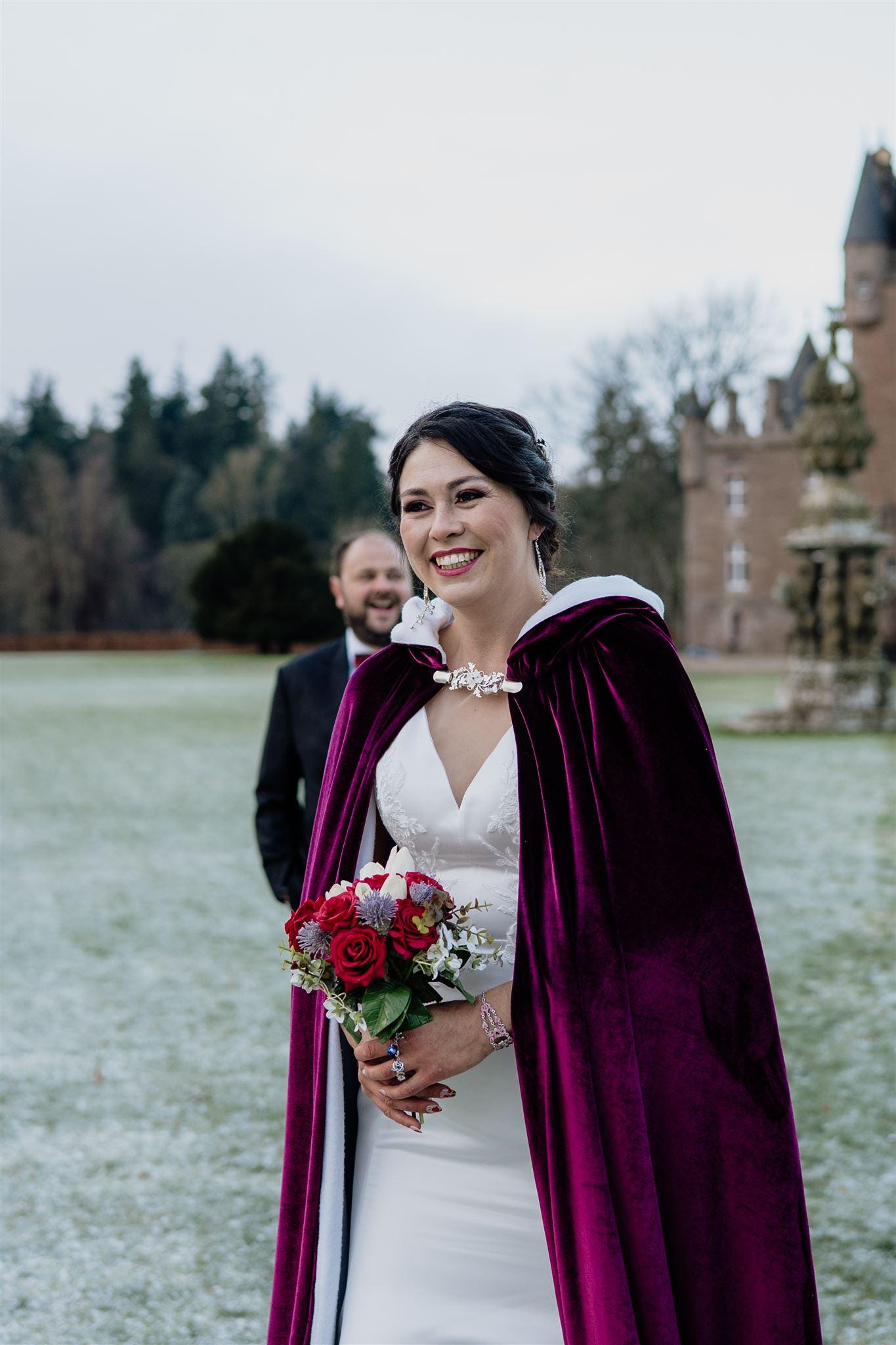 scottish bride with cape and castle wedding